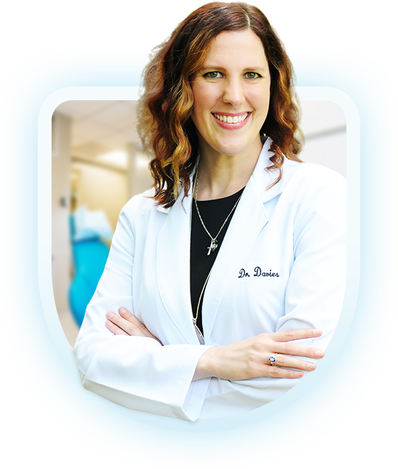 Photo of Dr. Jenna Davies with a badge that reads 'Jenna Davies DDS'